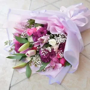 Beauty of Mixed Flowers: Pink Oriental Lilies, Pink and Dark Pink Roses, White and Pink Spray Roses, Purple Chrysanthemums, White Wax Flowers | Pink and Purple Wrap
