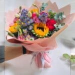 Bright Bliss: Hot Pink Roses, Sunflowers, and Lisianthus Arrangement