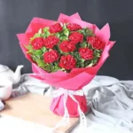 Carnation Elegance Bouquet: 11 Red Carnations | Green Leaves, Red Wrap, Ribbon Bow