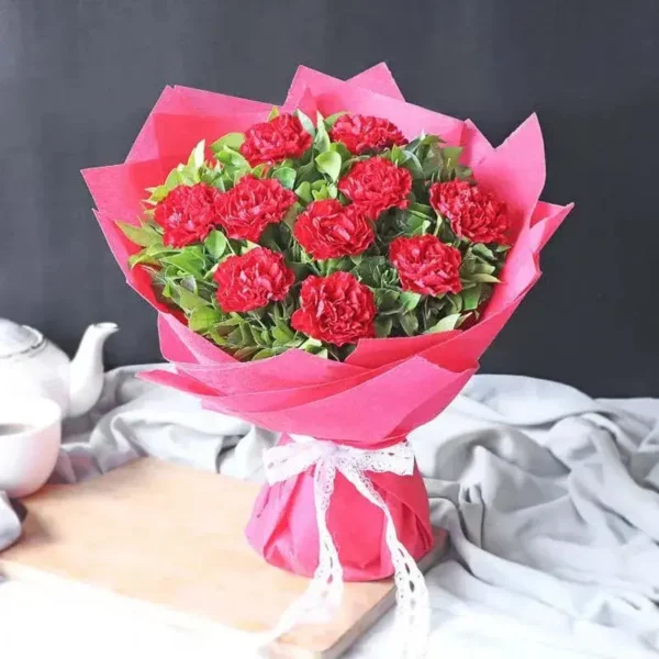 Carnation Elegance Bouquet: 11 Red Carnations | Green Leaves, Red Wrap, Ribbon Bow