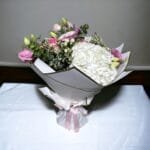 Pink Petal Paradise: Roses, Lisianthus, Hydrangea, Hypericum in White Wrap