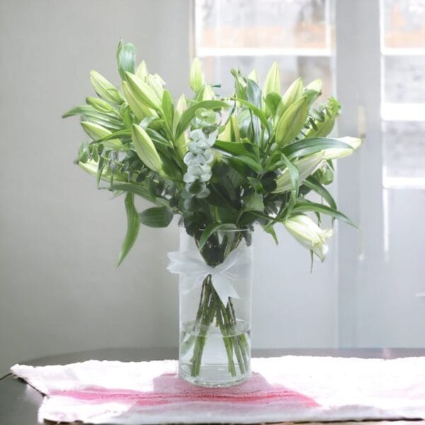 Sunny White Lily Cylinder Bouquet: Classic Arrangement of 10 White Lilies with Eucalyptus Accent
