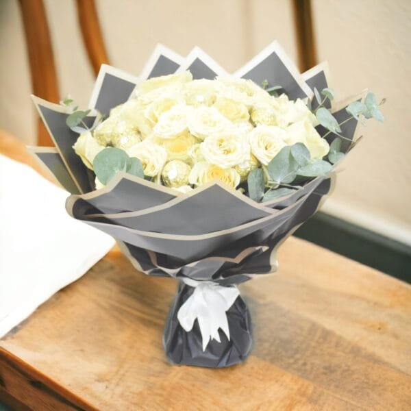 Creme Rose Ensemble: Classic Bouquet with Eucalyptus in Black Wrapping and White Ribbon