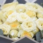 Creme Rose Ensemble: Classic Bouquet with Eucalyptus in Black Wrapping and White Ribbon