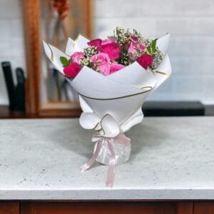 Classic Pink Medley: Hot Pink, Revival Pink Roses with Limonium and Ruscus in White and Pink