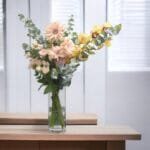 Elegant Garden: Cymbidium and Rose Pink Vase Arrangement with Eucalyptus and Gerbera