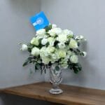 Exquisite White Hydrangea and Rose Arrangement in Glassware