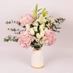 Blooms of Affection in Premium Ceramic Glass Vase: Pink Hydrangeas, White Roses, Oriental Lilies, Statice, Baby Blue Eucalyptus