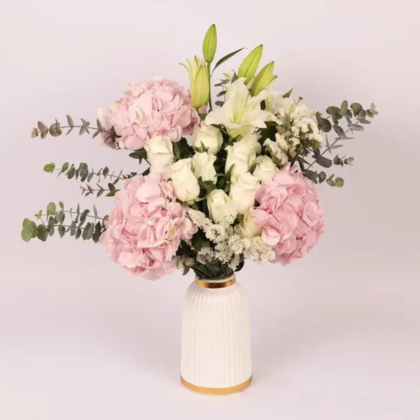 Blooms of Affection in Premium Ceramic Glass Vase: Pink Hydrangeas, White Roses, Oriental Lilies, Statice, Baby Blue Eucalyptus