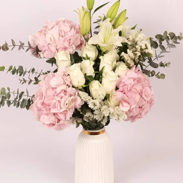 Blooms of Affection in Premium Ceramic Glass Vase: Pink Hydrangeas, White Roses, Oriental Lilies, Statice, Baby Blue Eucalyptus