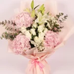 Pastel Paradise Bouquet: Pink Hydrangeas, White Roses, White Oriental Lilies, White Statice, Baby Blue Eucalyptus | Peach Wrap, Pink Ribbon Bow