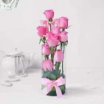 Pink Roses Cascade: Steps of Beauty in Vase - 10 Pink Roses, Green Leaves, Glass Vase, Ribbon Bow