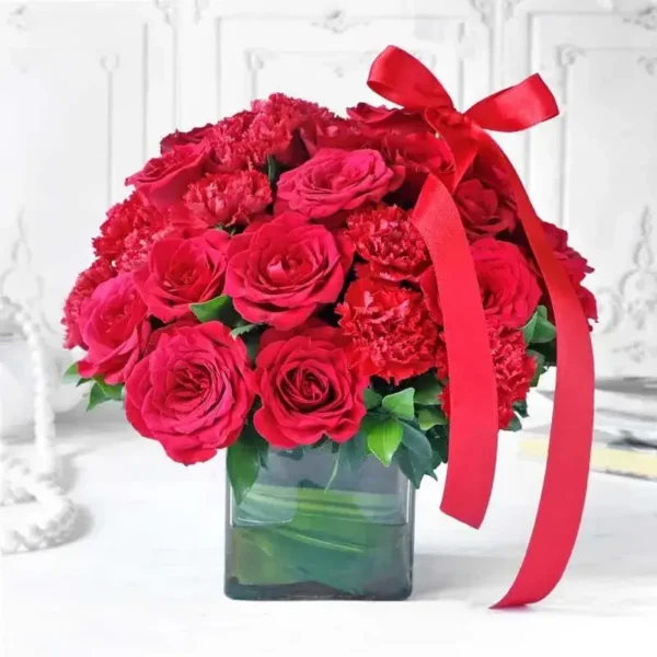 Red Roses & Carnations: A Stunning Arrangement - 20 Red Roses, 20 Red Carnations, Green Leaves, Square Glass Vase