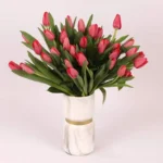 Scarlet Elegance: 31 Red Tulips in Glass Vase - Premium Floral Arrangement