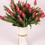 Scarlet Elegance: 31 Red Tulips in Glass Vase - Premium Floral Arrangement