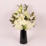 Serene Blooms: A Tranquil Display in Black Glass Vase - White Oriental Lilies, Hydrangeas, Calla Lilies, Carnations