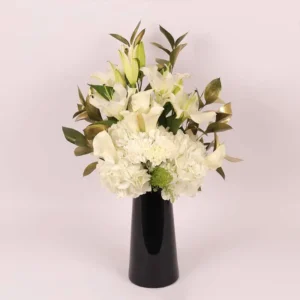 Serene Blooms: A Tranquil Display in Black Glass Vase - White Oriental Lilies, Hydrangeas, Calla Lilies, Carnations
