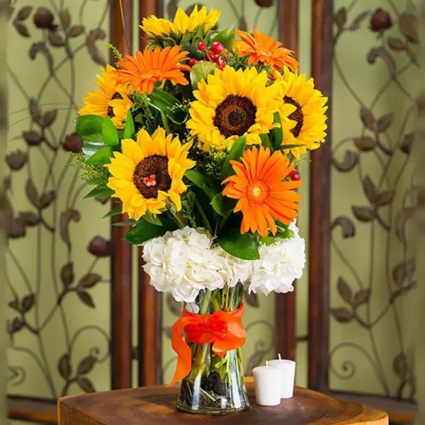 Sun Rays: A Radiant Floral Arrangement in Vase - White Hydrangea, Sunflowers, Orange Gerberas, Red Hypericum, Single Ruscus, Solidaster, Glass Vase with Ribbon Bow