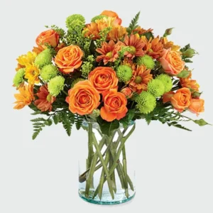 Sunset Floral Paradise: Blooms in Glass Vase - Orange Spray Roses, Chrysanthemums, Green Button Chrysanthemums, Leather Fern, Solidaster