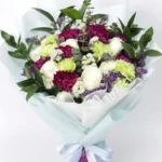 Youthful Blooms Bouquet: 6 White Roses, 8 Green Carnations, 7 Purple Carnations | 4 White Statice, Ruscus, Eucalyptus, Limonium | Sky Blue and White Wrap, Ribbon Bow